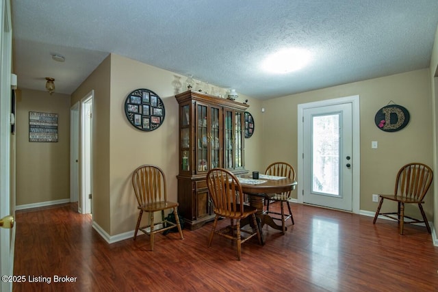 933 Lakeshore Pkwy, Brandenburg, KY 40108 - dining space featuring wood finished floors and a textured ceiling