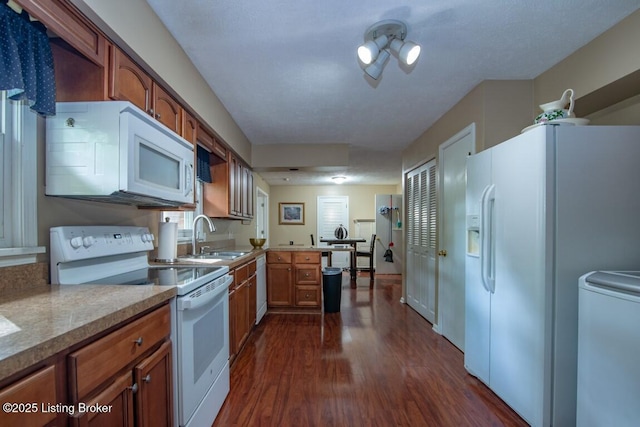 933 Lakeshore Pkwy, Brandenburg, KY 40108 - kitchen with white appliances, dark wood-style flooring, and brown cabinets