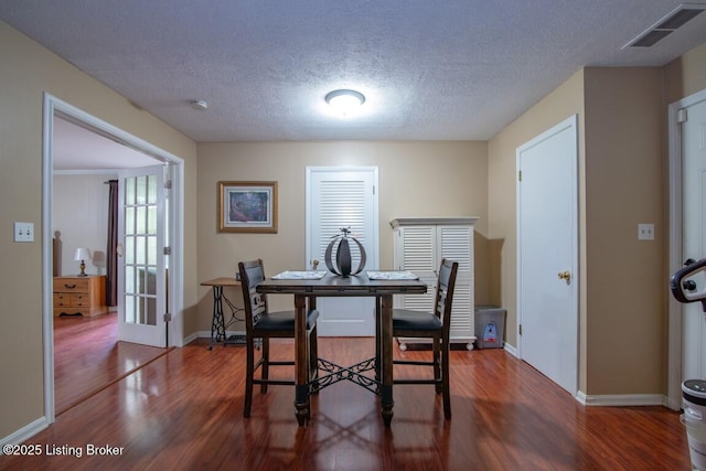 933 Lakeshore Pkwy, Brandenburg, KY 40108 - dining area featuring wood finished floors, a textured ceiling, and french doors