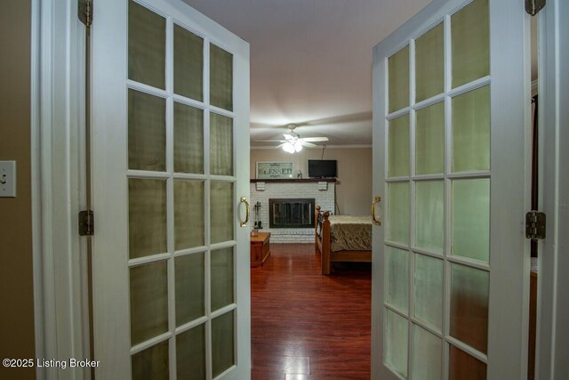 933 Lakeshore Pkwy, Brandenburg, KY 40108 - hall with dark wood-style floors, french doors, and crown molding