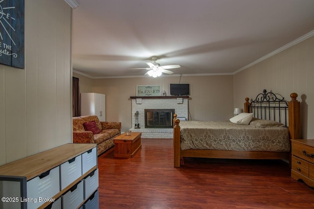 933 Lakeshore Pkwy, Brandenburg, KY 40108 - bedroom with crown molding, dark wood finished floors, a fireplace, and ceiling fan