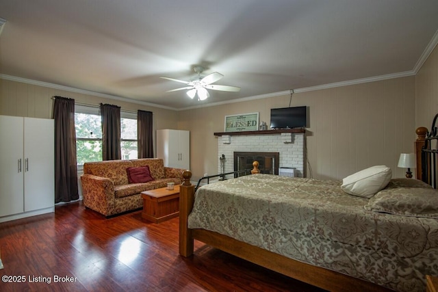 933 Lakeshore Pkwy, Brandenburg, KY 40108 - bedroom with wood finished floors, ornamental molding, a brick fireplace, and ceiling fan