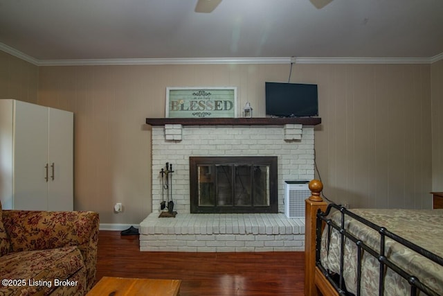 933 Lakeshore Pkwy, Brandenburg, KY 40108 - living room with crown molding, wood finished floors, a ceiling fan, and a brick fireplace