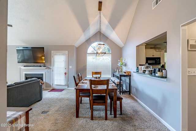 4101 Adelaide Ct, Louisville, KY 40241 - dining room featuring carpet floors, vaulted ceiling, a fireplace, and a chandelier