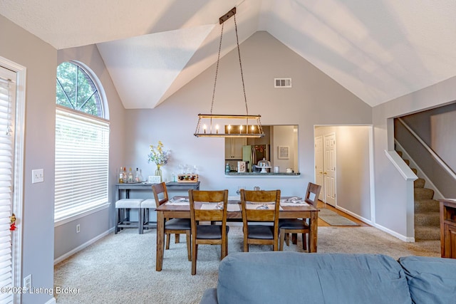 4101 Adelaide Ct, Louisville, KY 40241 - dining space with carpet flooring, stairway, a chandelier, and high vaulted ceiling