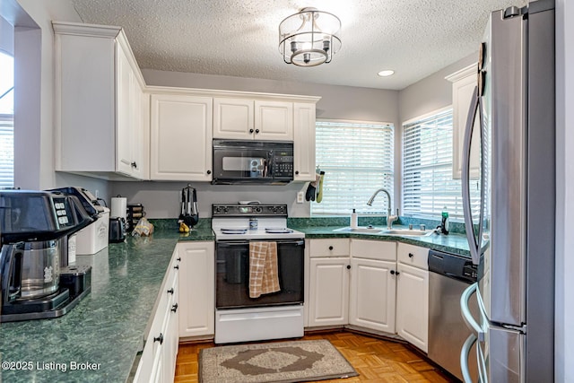 4101 Adelaide Ct, Louisville, KY 40241 - kitchen with appliances with stainless steel finishes, dark countertops, a textured ceiling, white cabinets, and recessed lighting