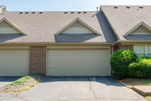 4101 Adelaide Ct, Louisville, KY 40241 - view of front of house featuring brick siding, roof with shingles, asphalt driveway, and an attached garage