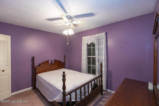 5709 Midnight Ln, Louisville, KY 40229 - carpeted bedroom with baseboards and ceiling fan