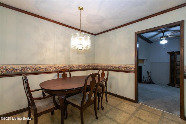 5709 Midnight Ln, Louisville, KY 40229 - dining room featuring crown molding, a wainscoted wall, a chandelier, a ceiling fan, and tile patterned floors