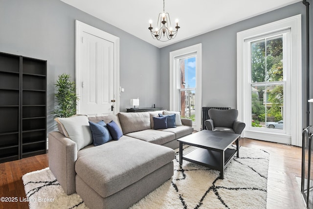 1080 Baxter Ave Unit 2, Louisville, KY 40204 - living room with a chandelier, wood finished floors, and vaulted ceiling
