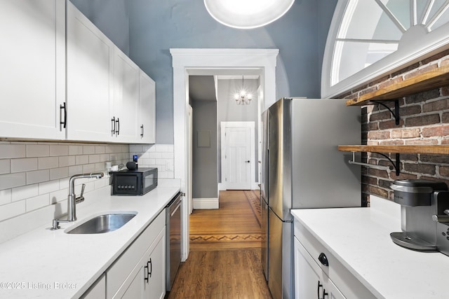 1080 Baxter Ave Unit 2, Louisville, KY 40204 - kitchen with stainless steel appliances, dark wood-style floors, light countertops, tasteful backsplash, and white cabinets