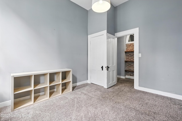 1080 Baxter Ave Unit 2, Louisville, KY 40204 - unfurnished bedroom featuring carpet flooring and a towering ceiling