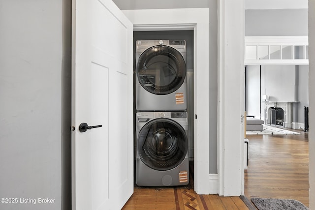 1080 Baxter Ave Unit 2, Louisville, KY 40204 - washroom with stacked washer and clothes dryer and wood finished floors