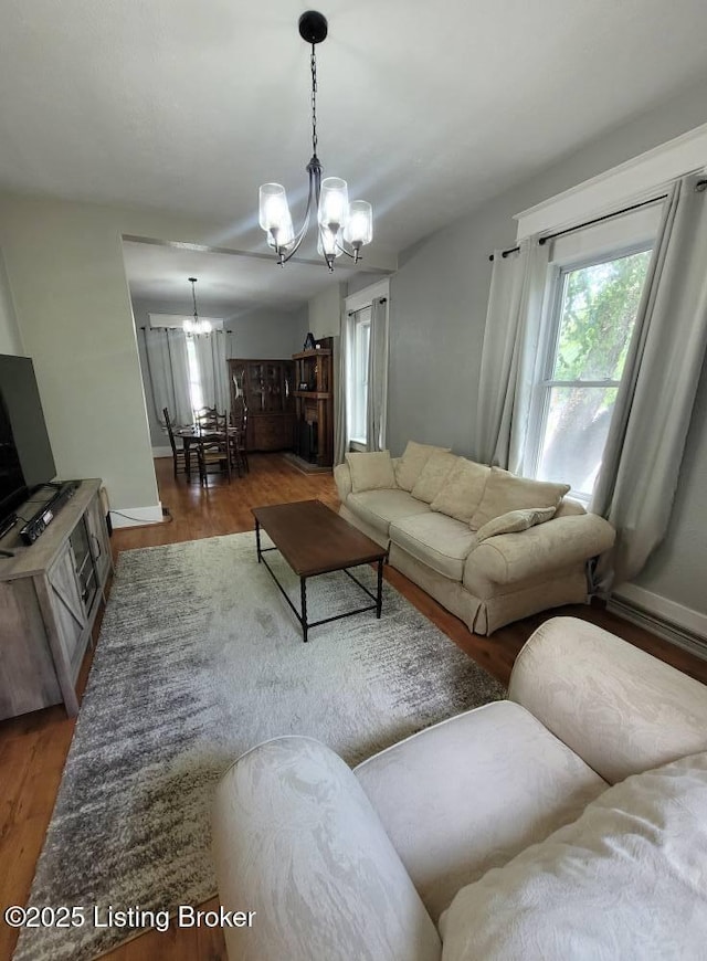 216 6th St, Carrollton, KY 41008 - living area featuring a chandelier and wood finished floors