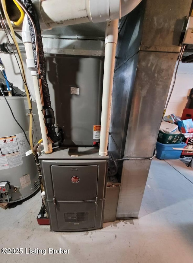 216 6th St, Carrollton, KY 41008 - utility room featuring gas water heater