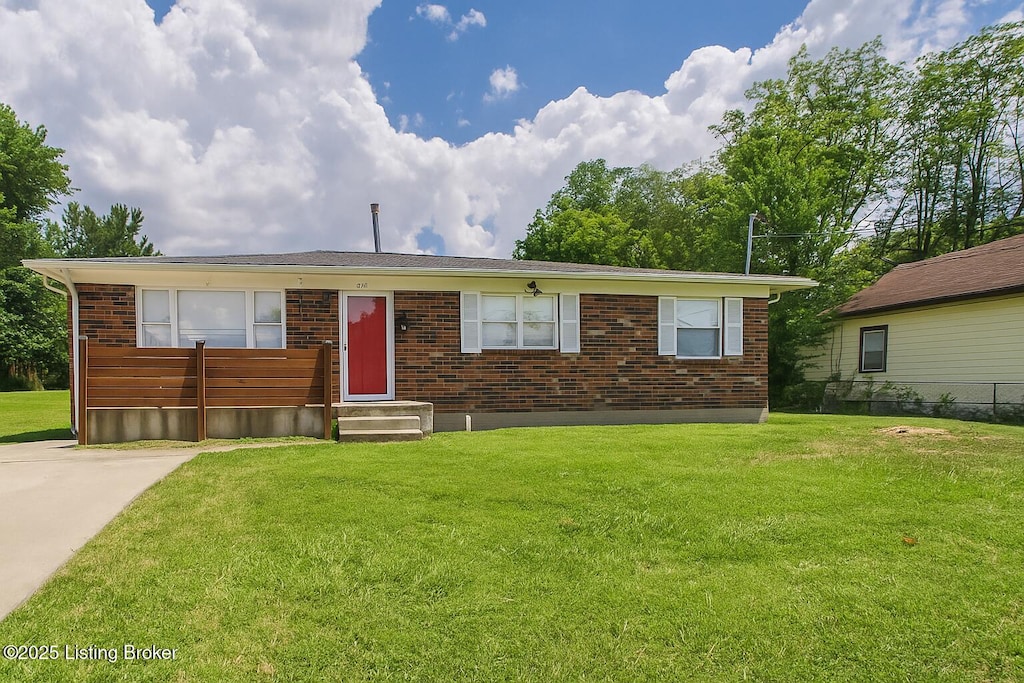 1519 S 32nd St, Louisville, KY 40211 - view of front of home with a front yard and brick siding