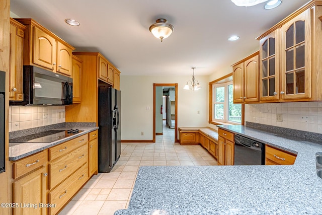 520 Ponder Dr, Shelbyville, KY 40065 - kitchen with black appliances, light tile patterned floors, a chandelier, glass insert cabinets, and backsplash