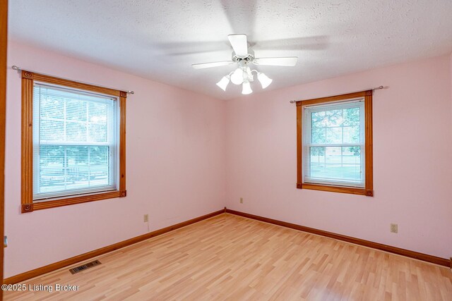 520 Ponder Dr, Shelbyville, KY 40065 - empty room featuring light wood-style floors, a textured ceiling, and a ceiling fan