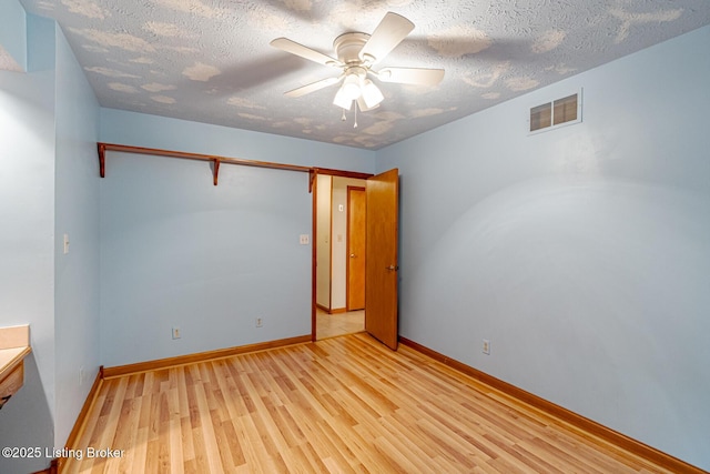520 Ponder Dr, Shelbyville, KY 40065 - unfurnished room with light wood finished floors, a textured ceiling, and a ceiling fan