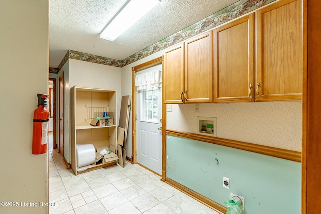 520 Ponder Dr, Shelbyville, KY 40065 - kitchen featuring a textured ceiling, light tile patterned floors, and brown cabinetry