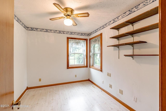 520 Ponder Dr, Shelbyville, KY 40065 - spare room with light wood-style flooring, a textured ceiling, and a ceiling fan