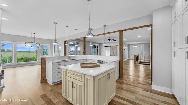 120 Lakelynn Ln, Shelbyville, KY 40065 - kitchen with a kitchen island, light wood-type flooring, light countertops, pendant lighting, and recessed lighting