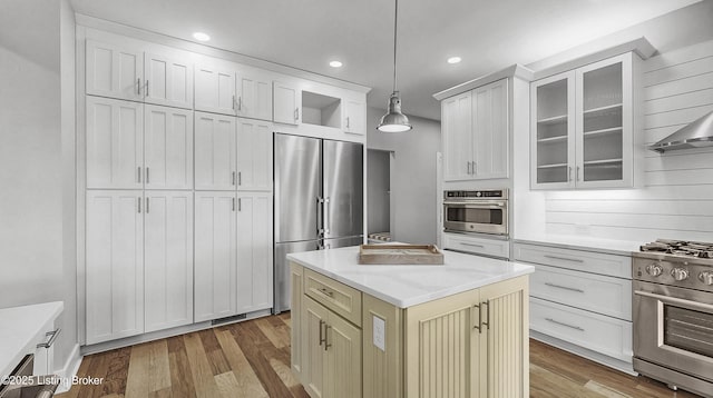 120 Lakelynn Ln, Shelbyville, KY 40065 - kitchen featuring high end appliances, decorative light fixtures, glass insert cabinets, wood finished floors, and open shelves