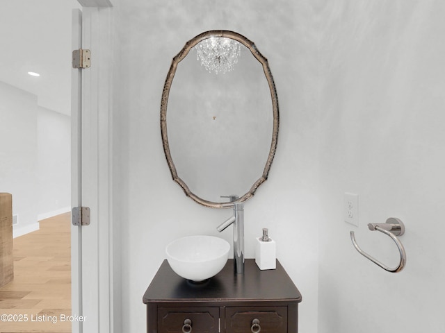 120 Lakelynn Ln, Shelbyville, KY 40065 - bathroom featuring wood finished floors, vanity, and a chandelier