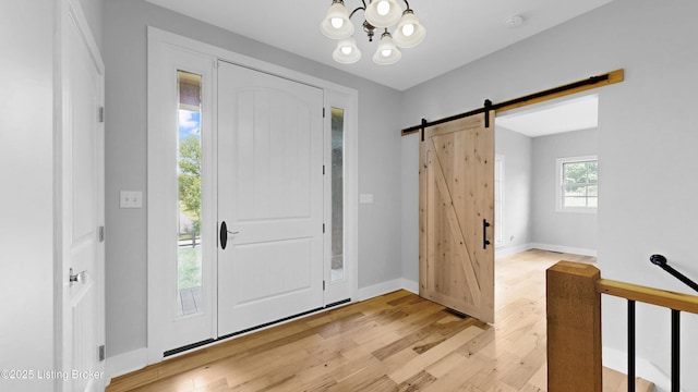 120 Lakelynn Ln, Shelbyville, KY 40065 - foyer entrance featuring light wood-type flooring, a chandelier, and a barn door
