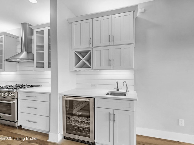 120 Lakelynn Ln, Shelbyville, KY 40065 - indoor wet bar featuring beverage cooler, high end stainless steel range, wall chimney exhaust hood, wood finished floors, and backsplash