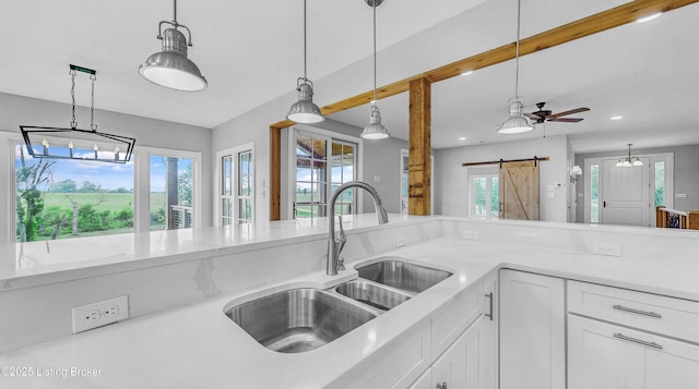 120 Lakelynn Ln, Shelbyville, KY 40065 - kitchen featuring a barn door, healthy amount of natural light, hanging light fixtures, white cabinetry, and recessed lighting
