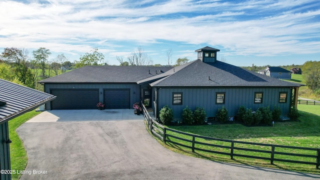 120 Lakelynn Ln, Shelbyville, KY 40065 - view of front facade with dirt driveway, a garage, roof with shingles, and board and batten siding