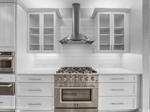 120 Lakelynn Ln, Shelbyville, KY 40065 - kitchen with appliances with stainless steel finishes, wall chimney exhaust hood, glass insert cabinets, and white cabinets