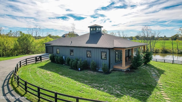 120 Lakelynn Ln, Shelbyville, KY 40065 - view of side of home featuring board and batten siding, a water view, and a shingled roof