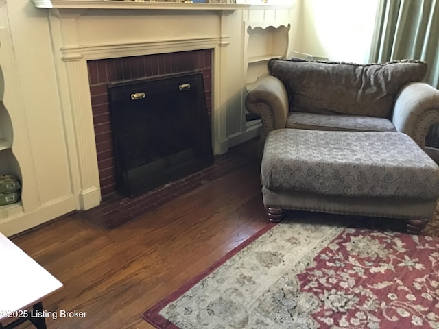 1852 Cypress St, Louisville, KY 40210 - sitting room with a fireplace and dark wood-style flooring