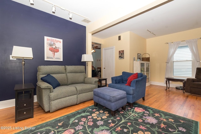 2309 Payne St, Louisville, KY 40206 - living room with rail lighting and wood finished floors