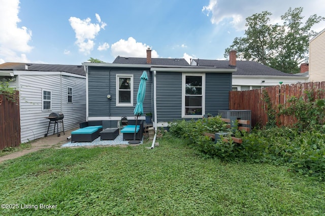 2309 Payne St, Louisville, KY 40206 - back of house with outdoor lounge area, a patio area, and a chimney