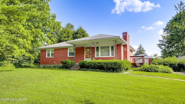 9706 Seatonville Rd, Louisville, KY 40291 - view of front of house featuring a chimney, a front yard, and brick siding