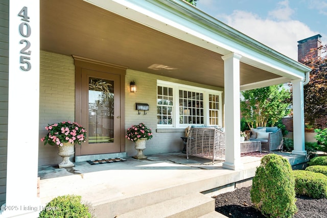 4025 Elmwood Ave, Louisville, KY 40207 - view of exterior entry with a porch and brick siding