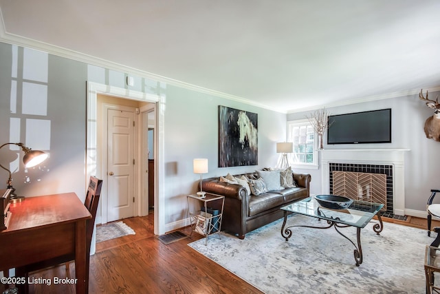 4025 Elmwood Ave, Louisville, KY 40207 - living room with ornamental molding, a tile fireplace, and wood finished floors