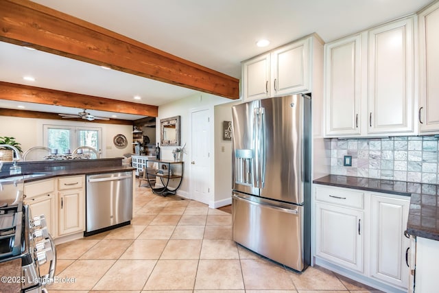 4025 Elmwood Ave, Louisville, KY 40207 - kitchen with appliances with stainless steel finishes, dark countertops, recessed lighting, light tile patterned floors, and decorative backsplash