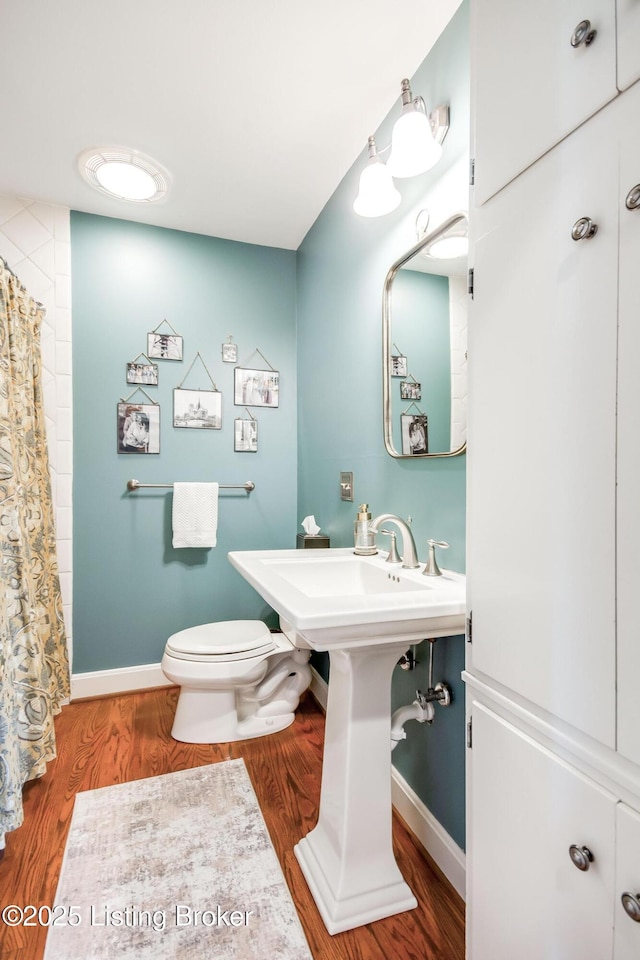 4025 Elmwood Ave, Louisville, KY 40207 - bathroom featuring wood finished floors and a shower with curtain