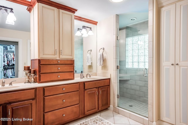 4025 Elmwood Ave, Louisville, KY 40207 - bathroom with a shower stall, tile patterned floors, double vanity, and a spacious closet