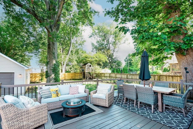 4025 Elmwood Ave, Louisville, KY 40207 - wooden deck with an outdoor hangout area, a fenced backyard, outdoor dining space, and a playground