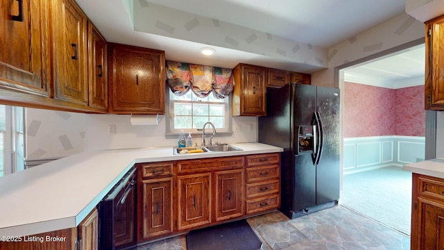 1810 Bainbridge Row Dr, Louisville, KY 40207 - kitchen featuring black appliances, light countertops, a wainscoted wall, wallpapered walls, and brown cabinetry
