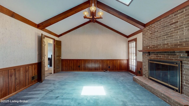 1810 Bainbridge Row Dr, Louisville, KY 40207 - unfurnished living room with a wainscoted wall, a chandelier, wooden walls, carpet floors, and a brick fireplace