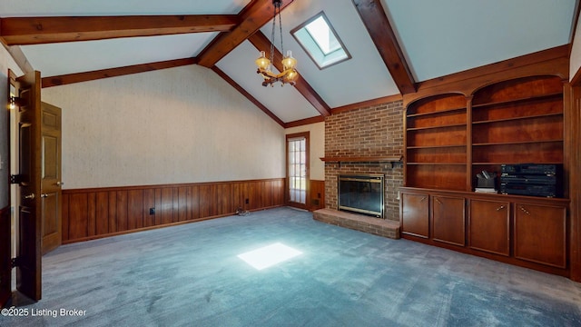 1810 Bainbridge Row Dr, Louisville, KY 40207 - unfurnished living room with a skylight, wainscoting, wooden walls, a fireplace, and beamed ceiling