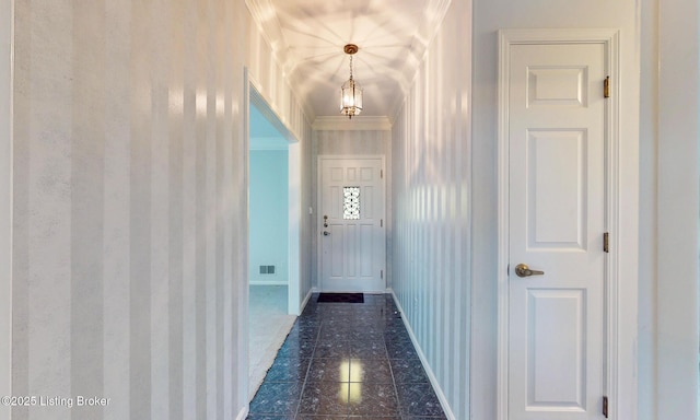 1810 Bainbridge Row Dr, Louisville, KY 40207 - doorway with wallpapered walls, a chandelier, dark tile patterned floors, and crown molding