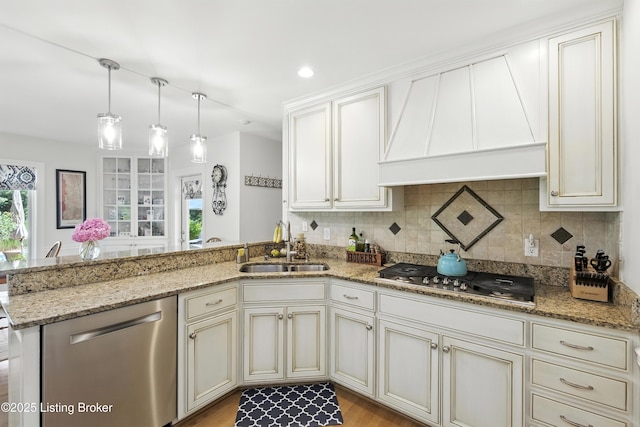 1375 Waxwing Pl, Louisville, KY 40223 - kitchen featuring stainless steel appliances, custom range hood, a peninsula, light stone countertops, and backsplash