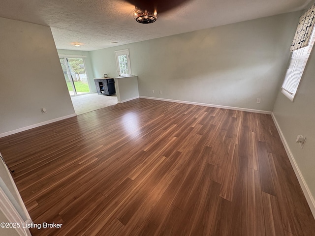 11902 Queen Annes Ct, Louisville, KY 40245 - unfurnished living room featuring dark wood-style flooring and baseboards
